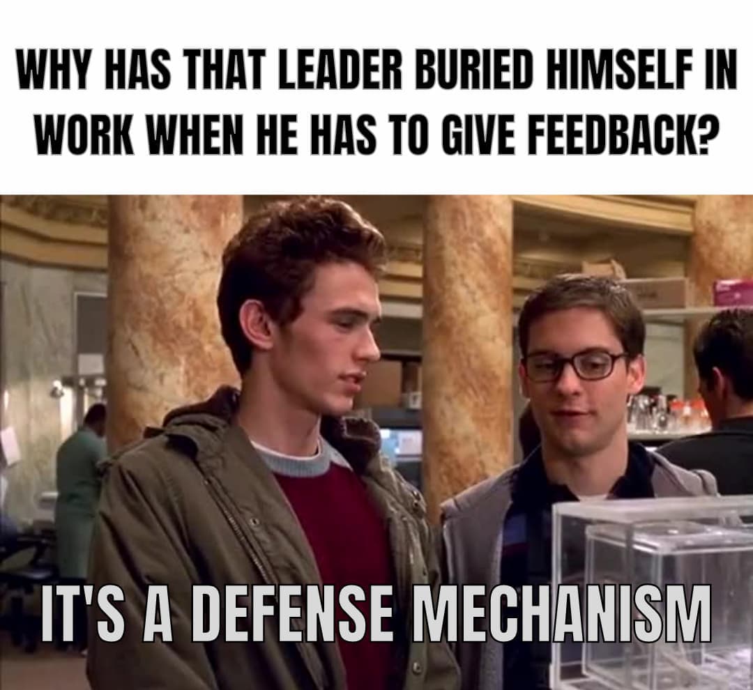 Meme with the writings "Why has that Leader Buried Himself in work when he has to give feedback?" "It's a Defence mechanism." The Meme is based on a scene from Spiderman when Peter says that the spider has a defence mechanism.